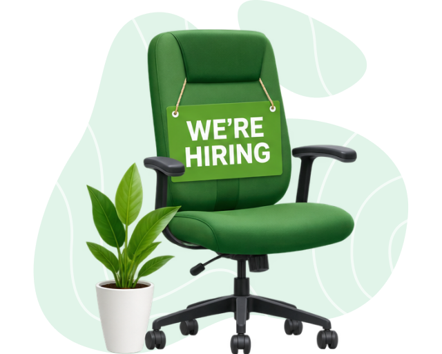 Office chair with We're Hiring badge and plant